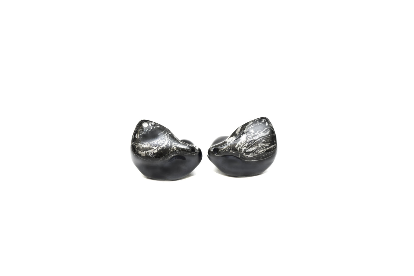 A pair of black custom in-ear monitors with a distinctive design, featuring a black and silver color scheme and a metallic finish now on a white background.
