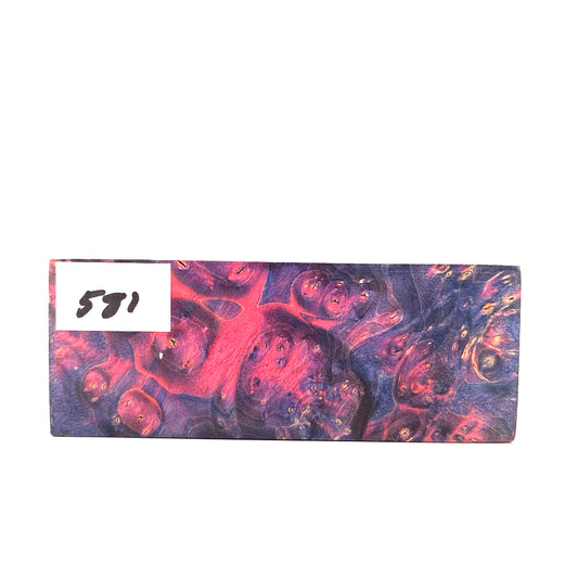 Marbled pink and purple rectangular object with a number 581 on a white background