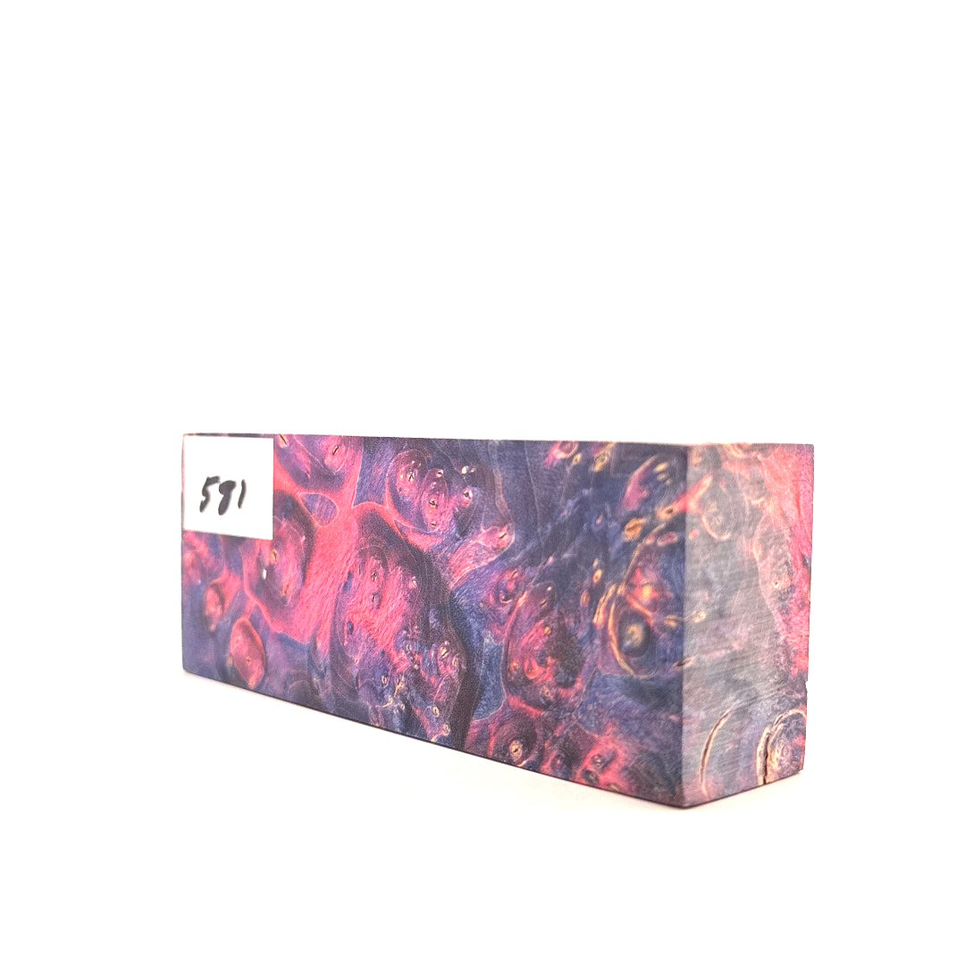 Marbled pink and purple block with a label on a white background