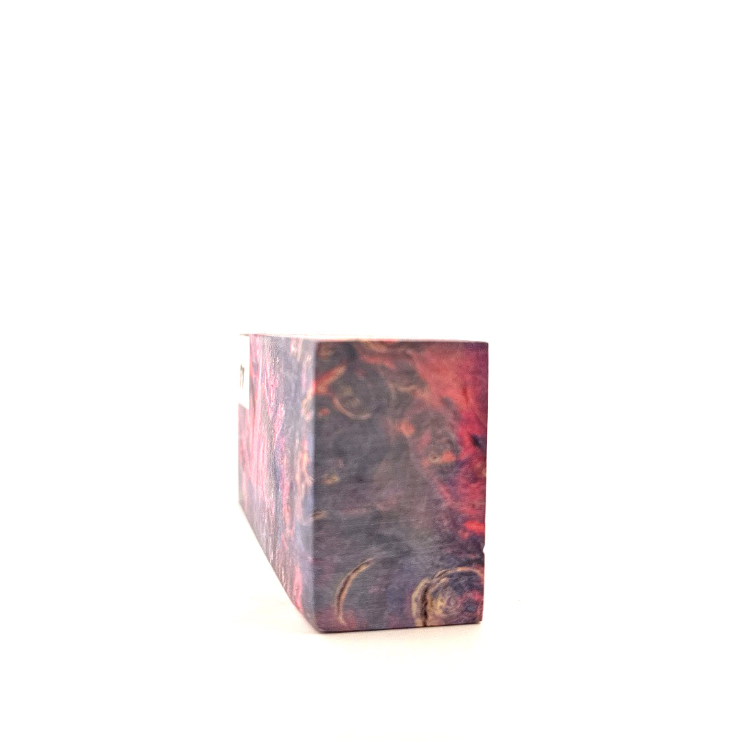 Marbled rectangular block with red and brown patterns on a white background