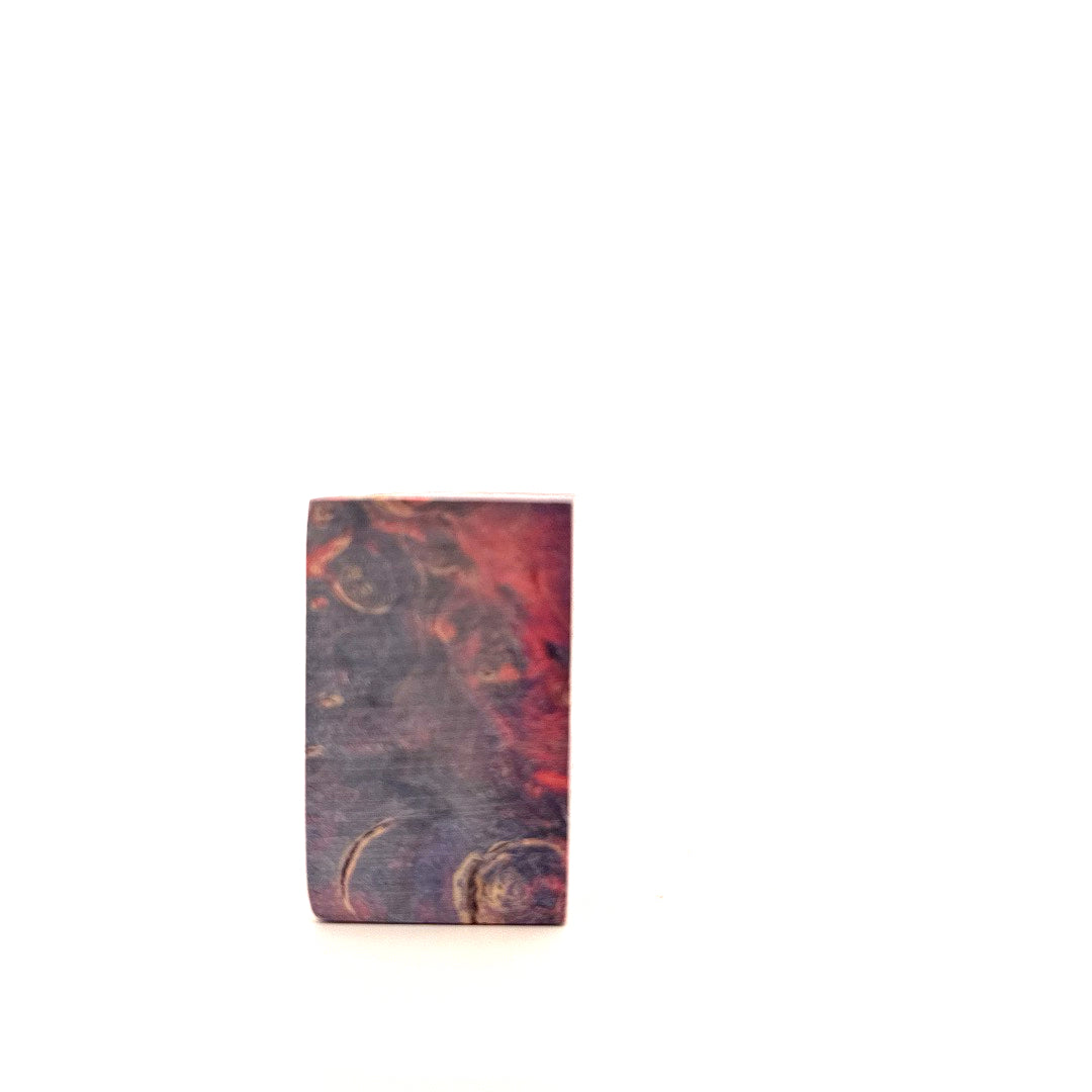 Rectangular wooden block with marbled pattern on a white background