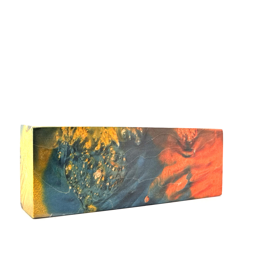 Rectangular block of wood multicolored marbled pattern on a white background