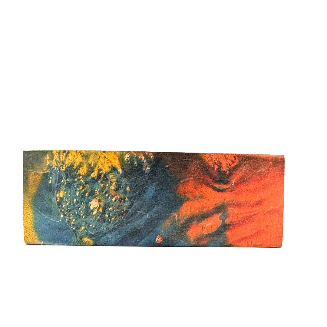 Rectangular piece of wood with abstract multicolor design on a white background