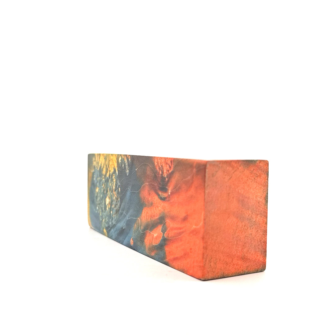 Wooden block with abstract design on a white background