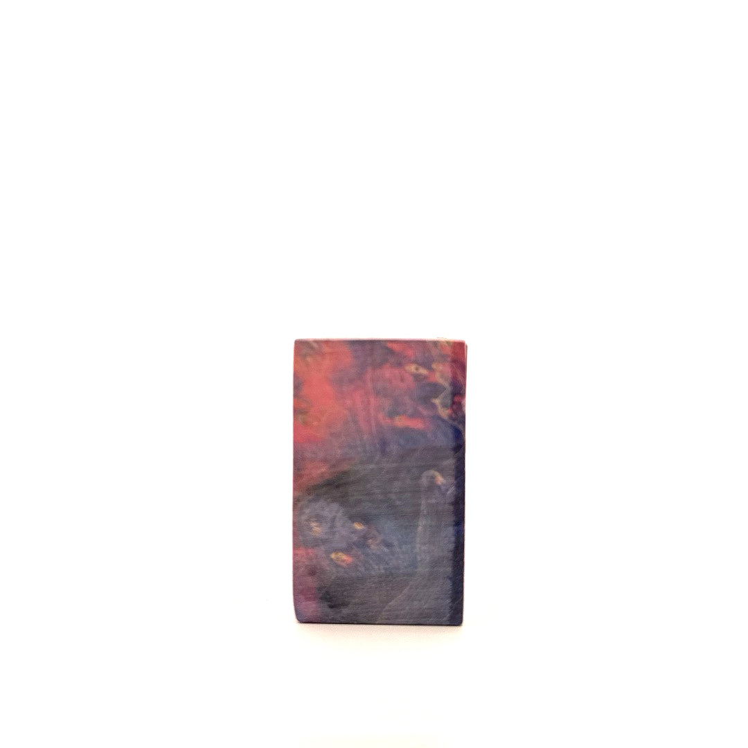 Wooden block with a marbled pattern on a white background