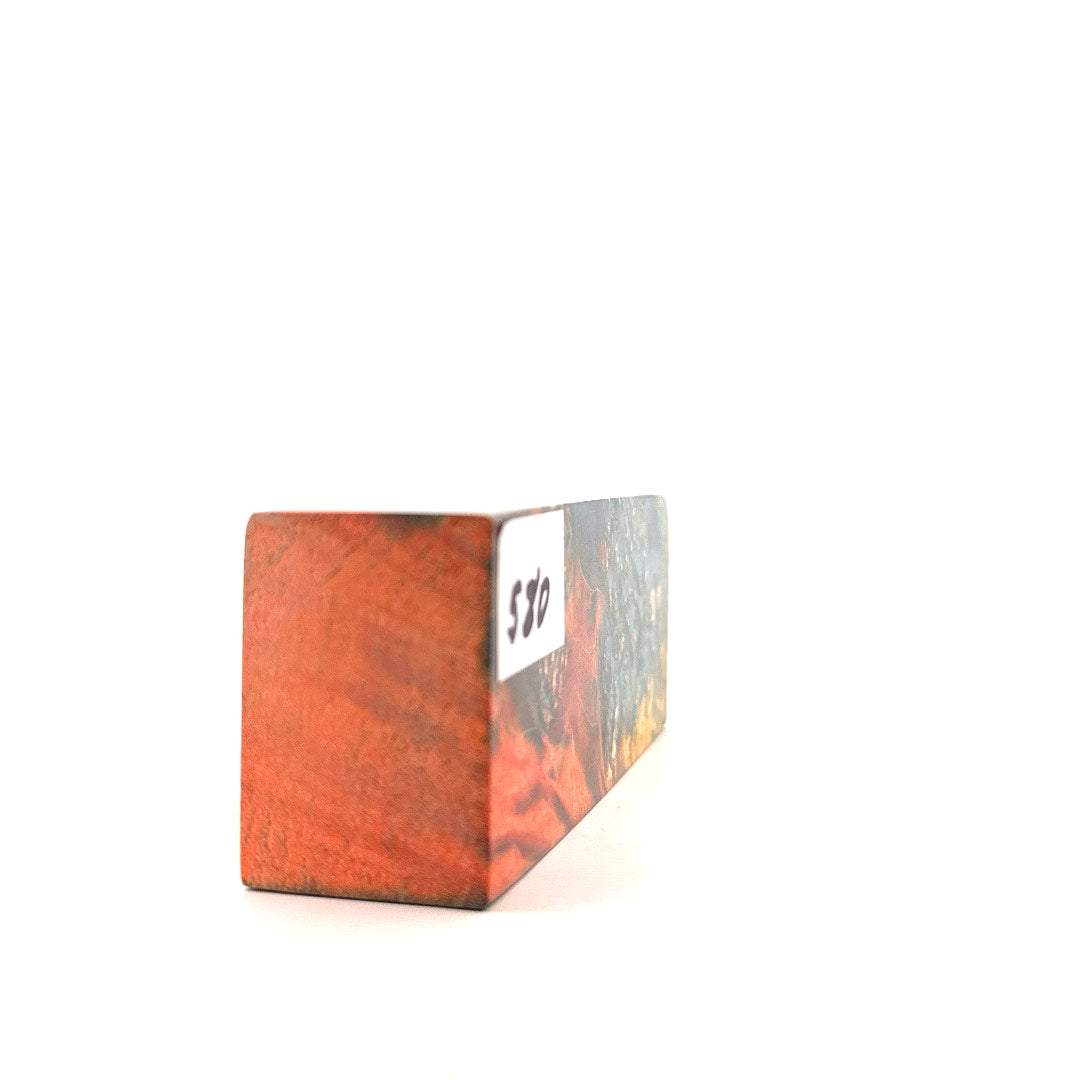 Wooden block with a white label on a white background