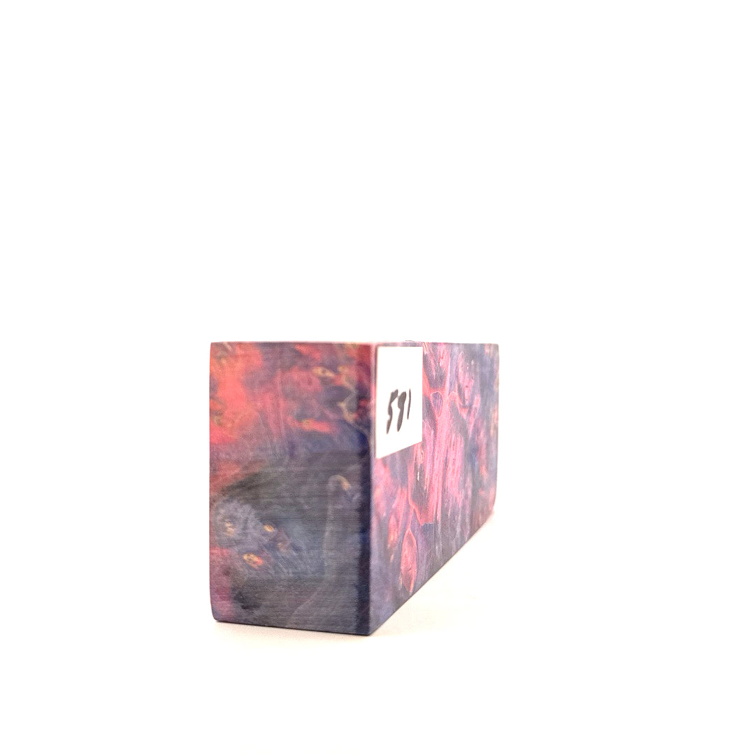 Wooden block with marbled pattern on a white background