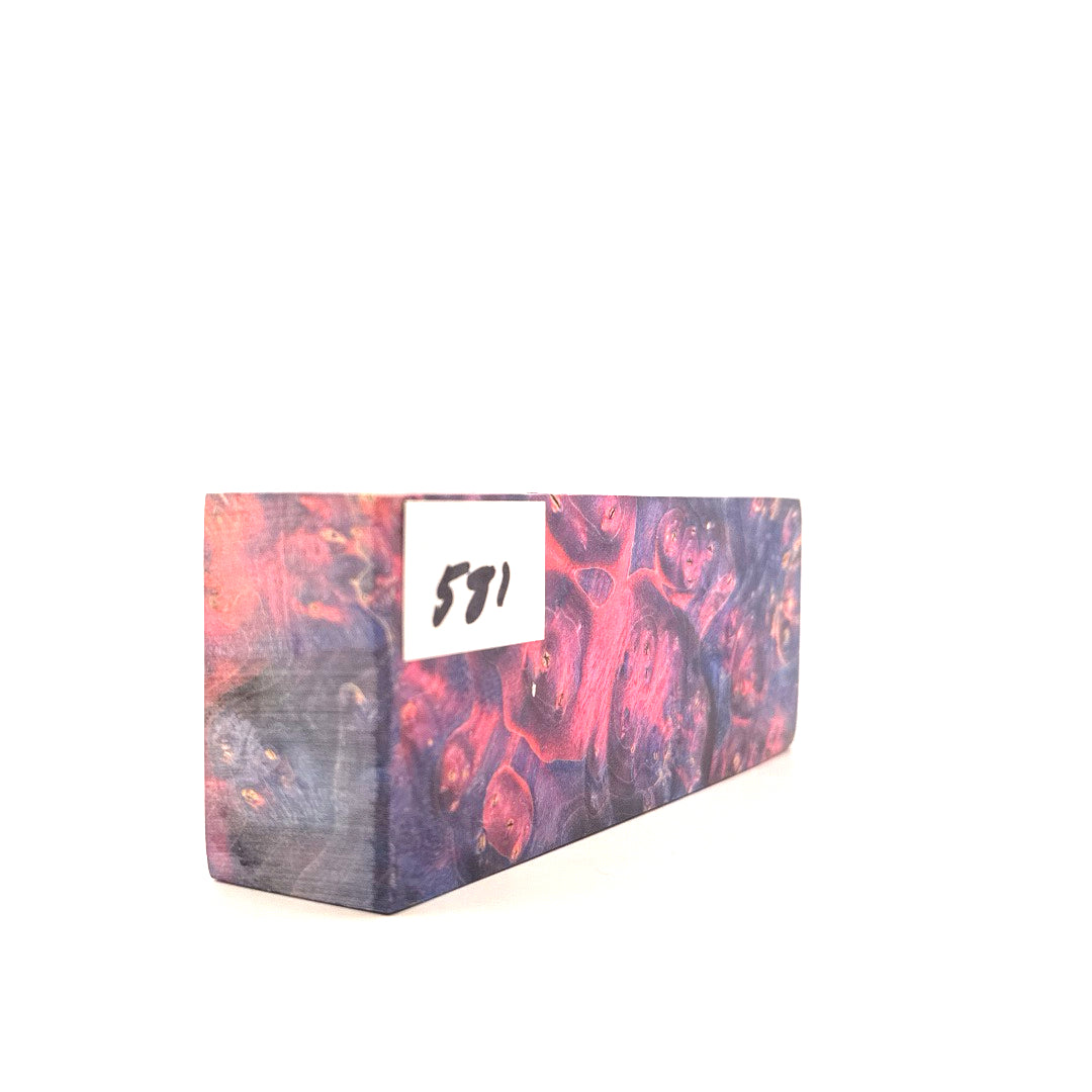 Marbled pink and purple block with a white label on a white background