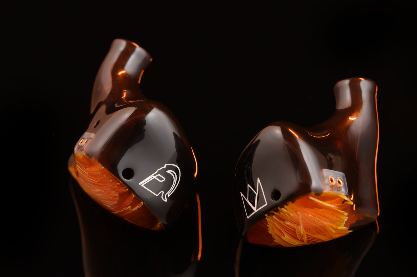 Spartakus IEM's featuring a red tinted wire mesh faceplate and shell.
