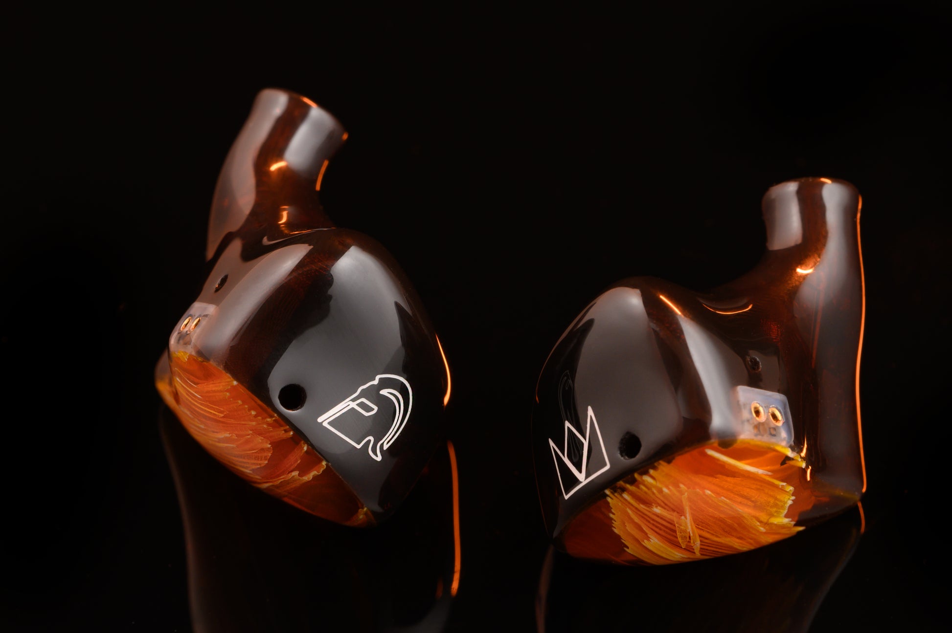 Spartakus IEM's featuring a red tinted wire mesh faceplate and shell.