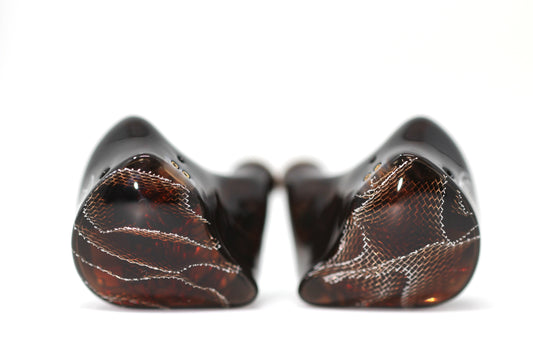 Spartakus IEM's featuring a red tinted wire mesh faceplate and shell.