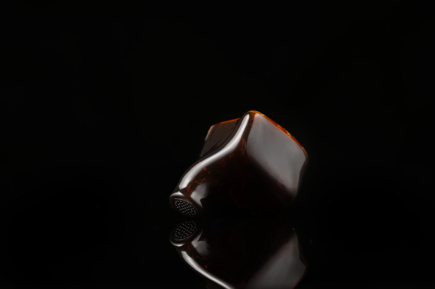 Spartakus IEM's featuring a red tinted wire mesh faceplate and shell.