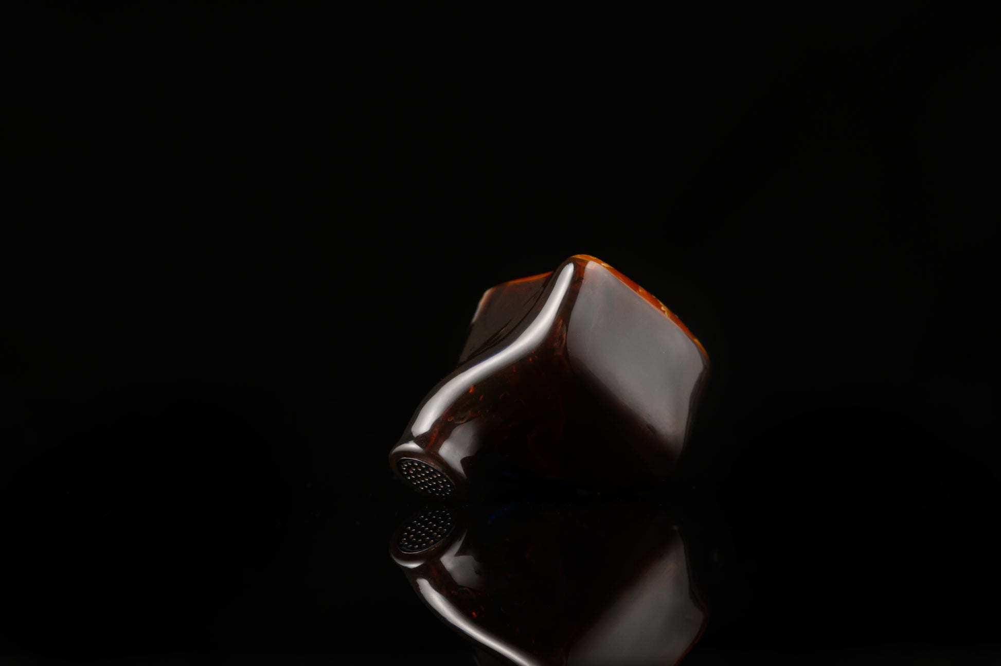 Spartakus IEM's featuring a red tinted wire mesh faceplate and shell.
