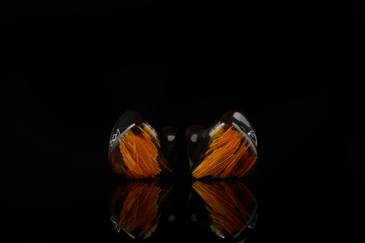 Spartakus IEM's featuring a red tinted fiberous faceplate and shell.